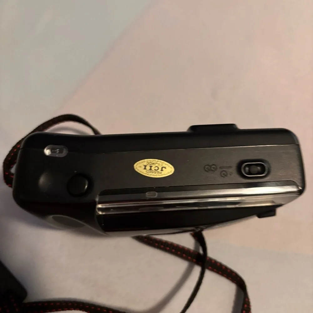 Nikon Black Camera with Red Accents and Case don’t know if it works